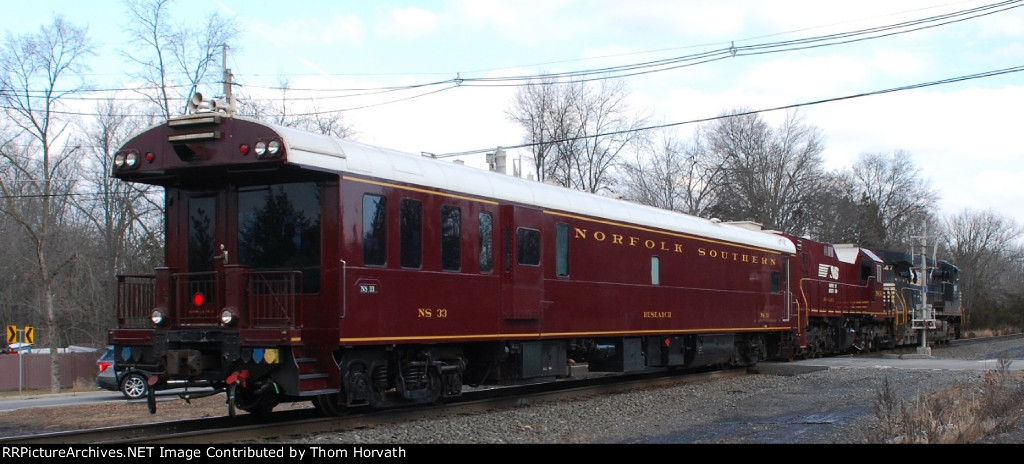 NS 33 is in the consist of NS's Geometry Train heading east